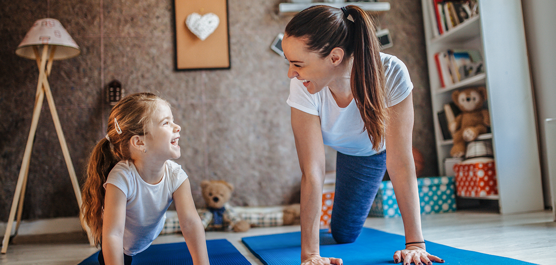 A girl and kid doing exercises